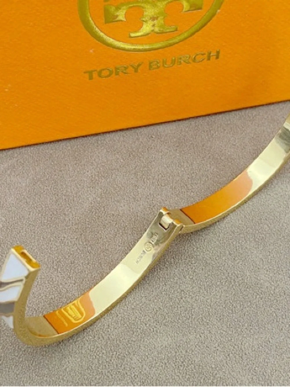 Tory Burch Gold Bracelet with White and Light Gray Enamel Stripes